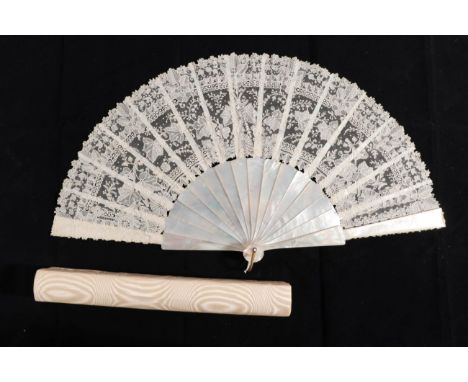 Dame Margot Fonteyn: A Late 19th Century White Mother-of-Pearl Fan, the sticks plain, with metal loop. Mounted with a Brussel