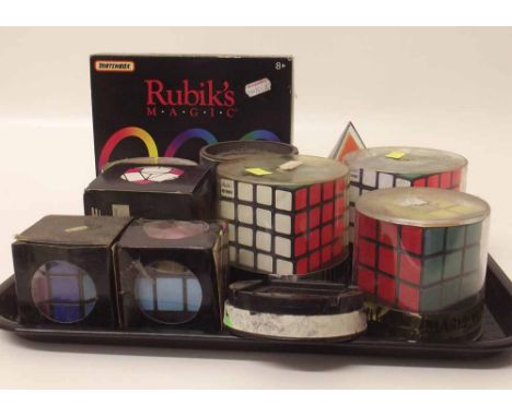 Nine early Rubiks cubes, pyramid puzzle and Rubiks magic puzzle. Condition report: see terms and conditions