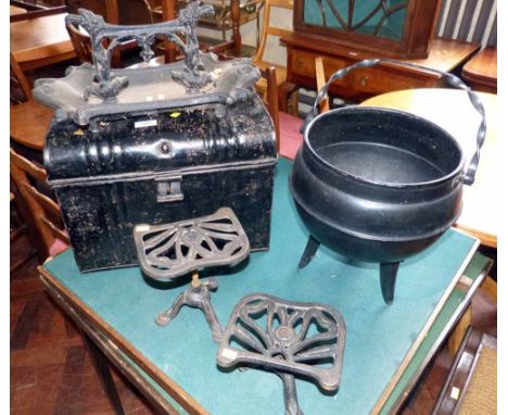 Cast iron foot scraper, two trivets, cauldron and small tin trunk. Condition report: see terms and conditions