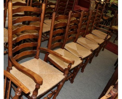 A set of six oak Lancashire style ladder back rush seated chairs (4+2) 