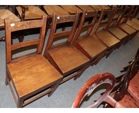 A set of six 19th century country chairs with boarded seats; and a pair of ladder back rush seated chairs together with a 19t