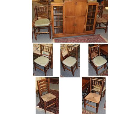 Set of six late 19th century oak and rush seated dining chairs; together with a single rush seated ladder backed dining chair