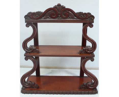 A mahogany two shelf hanging whatnot, with carved scrolling decoration. 55cm