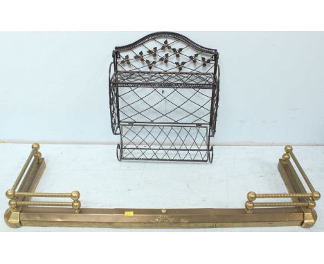 An early 20th century brass fire surround, together with a wire wall shelf. (2)