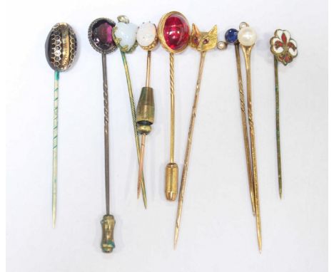 A collection of nine assorted tie pins, including a 9ct gold fox head, an opal, pearl, enamel, amethyst and others