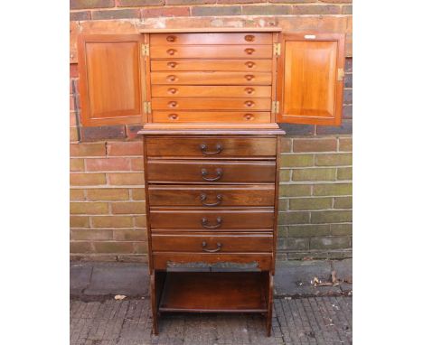 An Edwardian stained walnut five-drawer music cabinet, together with an early 20th Century stained-wood piano stool, and sati