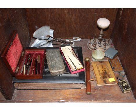 Various collectables including a Japanese postcard album, pincushion bobbin stand, various bone bobbins, fountain pens, shoe 