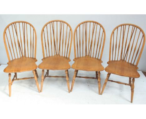 A set of four beechwood, hoop shape, stick back Windsor style kitchen chairs