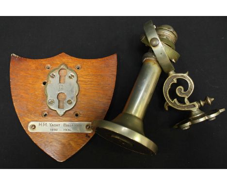 A Ships brass gimbal light from HM Yacht Britannia, with silver plated plaque and mounted on an oak shield
