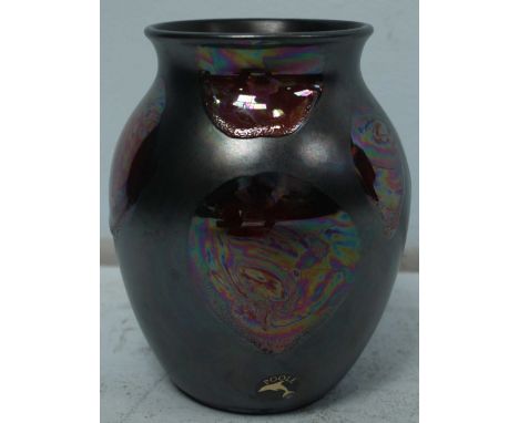 A Poole Pottery galaxy vase, painted in matte black and iridescent tones, decorated with raised burnt orange simulated lava p