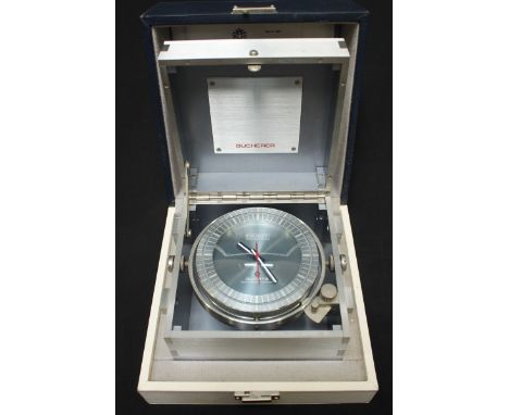An unusual Bucherer Swissonic Quartz metal cased chronometer type table clock, c.1980, with gimbal mount, the grey dial with 