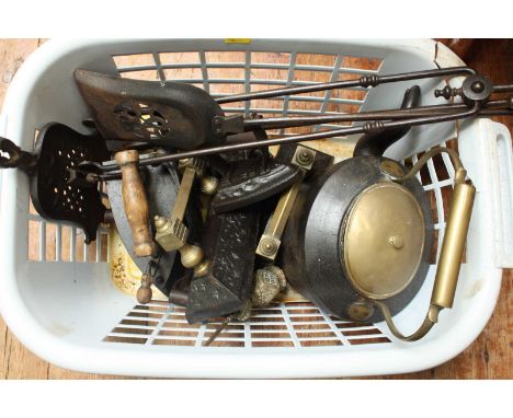 A set of brass fire irons together with a pair of andirons, metal kettle, clothes iron and other items