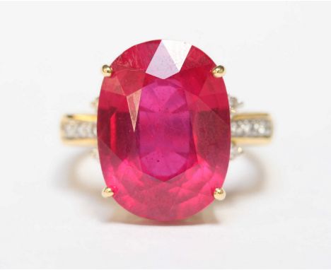 An 18ct gold, ruby and diamond ring, set with large oval ruby weighing approx 15.95cts, the shoulders set with diamonds total