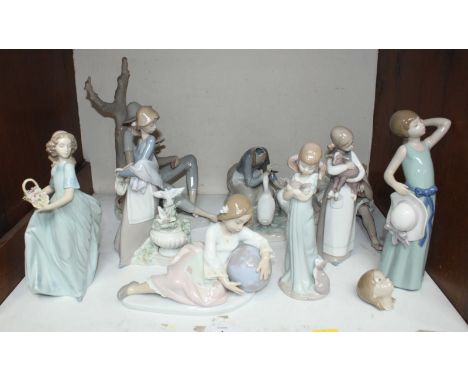 SECTION 1. Eight various Lladro figures, three with original boxes together with a Nao figure-group of a boy sat against a tr