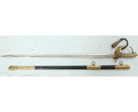 An 1827 pattern naval officers sword, with brass handle guard, fish skin grip and lions head pommel, the Wilkinson Sword blad