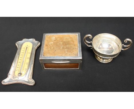 An Edwardian silver mounted thermometer, hallmarked Chester 1907, together with a silver mounted wooden box and a small silve