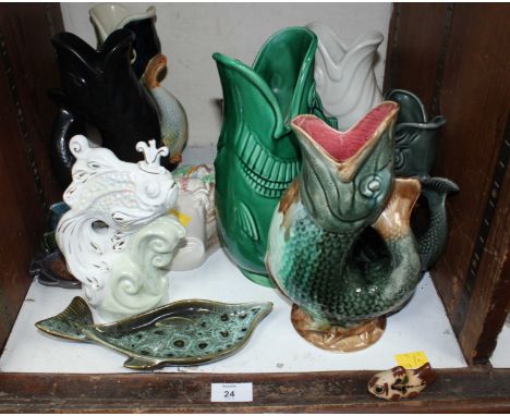 SECTION 24. A collection of assorted ceramic fish ornaments, and a Clarice Cliff wall pocket