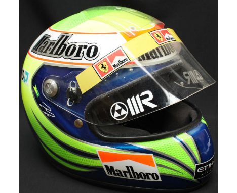 A Formula 1 Felipe Massa replica racing drivers helmet, c.2010 when Massa was driving for Ferrari. This is a replica only and