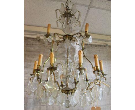 CHANDELIER, Continental style with sixteen branches and faceted glass drops, approx 102cm H x 65cm W. (with faults)