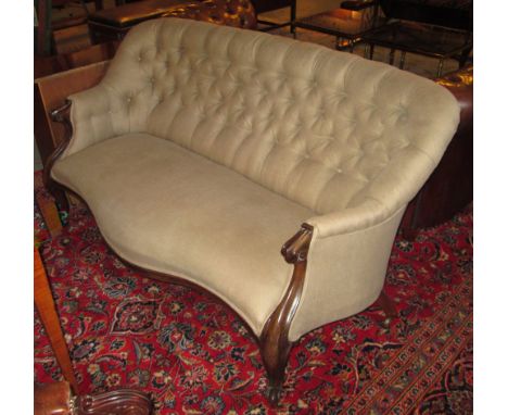 SOFA, Victorian rosewood framed with a buttoned back and sides and taupe upholstery having a serpentine shaped front on short