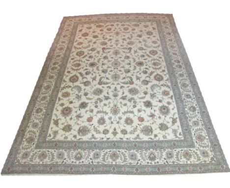 EXTREMELY FINE SILK AND WOOL TABRIZ CARPET, 352cm x 250cm, allover design of palmettes and scrolling vines on an ivory field 