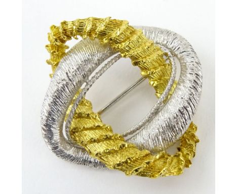 Vintage Italian 18 Karat Yellow and White Gold Knot Brooch. Signed Italy 18K. Good condition. Measures 1-1/2" x 1-3/8". Appro