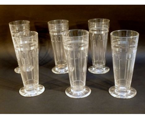 A SET OF SIX EDWARDIAN STUART TAPERING CYLINDRICAL TUMBLERS WITH CUT FLOWERS BENEATH REEDED BANDS, ON A SPREADING FOOT (H: 16