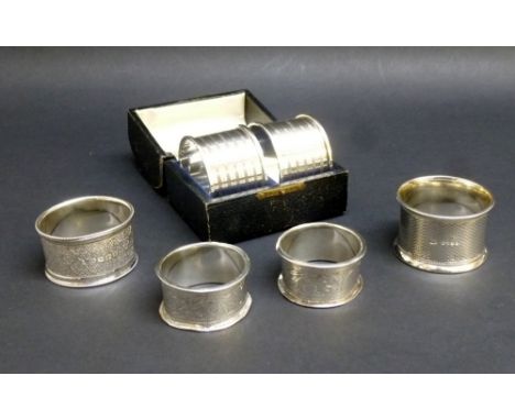 PAIR OF SILVER NAPKIN RINGS WITH VACANT CARTOUCHES, CHESTER 1926, CASED, A PAIR OF SILVER NAPKIN RINGS WITH FLORAL ENGRAVING 