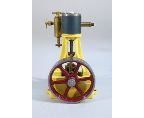 STUART TURNER No. 7A VERTICAL STEAM ENGINE IN YELLOW COMPRISING OF SINGLE VERTICAL CYLINDER SUSPENDED ON A SINGLE A-FRAME, WI