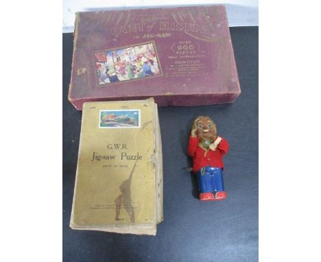 Two vintage jigsaw puzzles including GWR "Cornish Riviera" along with a clockwork toy A/F