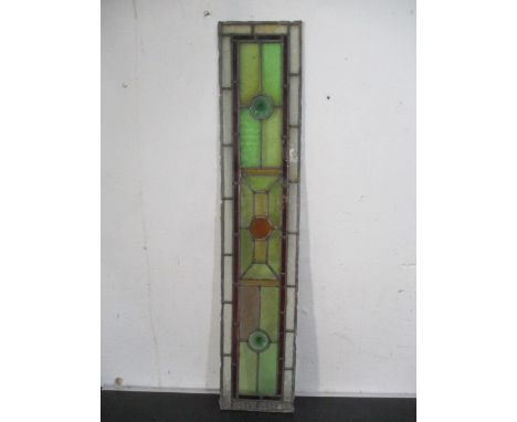 A vintage narrow stained glass panel