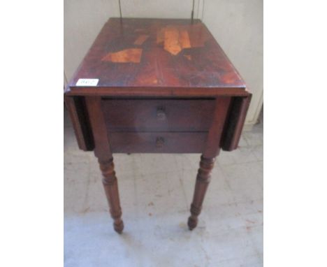 A Victorian Pembroke style commode with two drawers to one side and drop down cupboard to the other