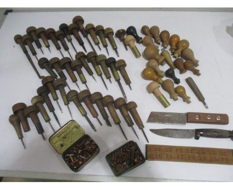 A collection of vintage leather working tools etc