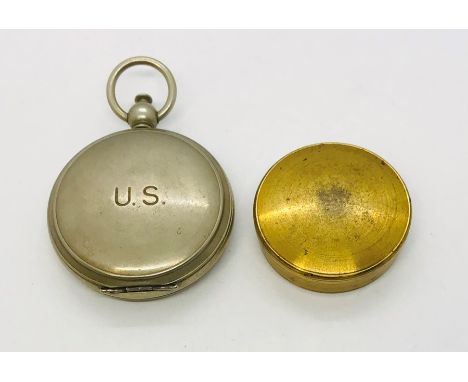 A Wittnauer steel US forces compass along with a brass compass 