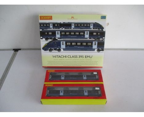 A boxed Hornby (R2821) 00 gauge "Hitachi Class 395 EMU" train pack, along with two boxed carriages  