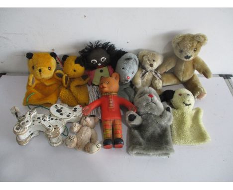 A collection of various vintage teddies, puppets etc