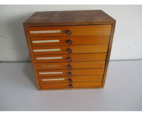 A vintage wooden set of eight drawers