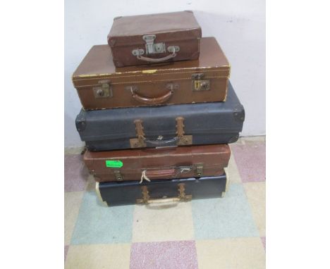 A collection of five vintage suitcases