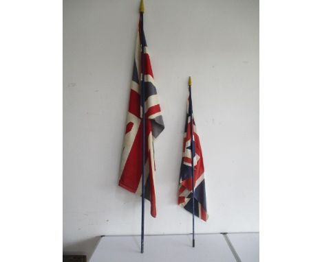 Two vintage union jack flags on poles
