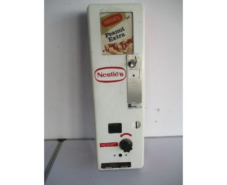 A vintage Nestle's Chocolate vending machine