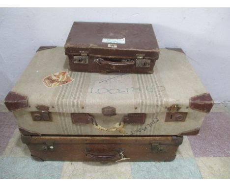 Two vintage suitcases along with a small case
