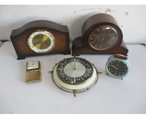 A collection of five clocks, including a Smiths mantle clock, Bentina mantle clock, travel clock, vintage alarm clock etc