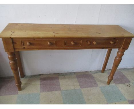 A pine buffet with three drawers, 152cm width