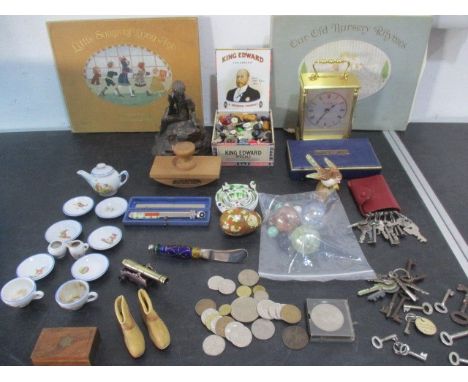 A collection of miscellaneous items including a part dolls tea set, buttons, various keys, carriage clock etc.