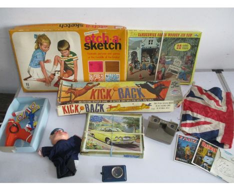 A collection of vintage toys, games and jigsaw puzzles including Kick Back, Etch-a-Sketch, View-master with 3 reels including