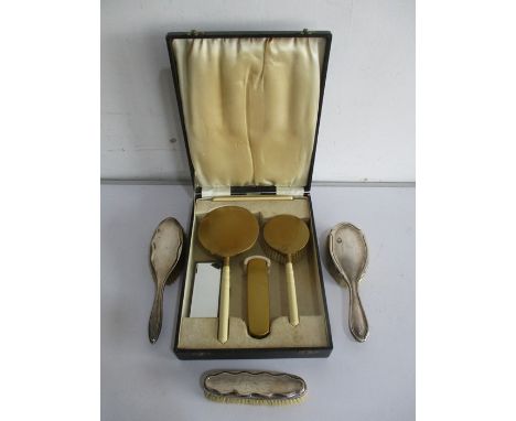 A cased Art Deco dressing table set along with 3 hallmarked silver brushes