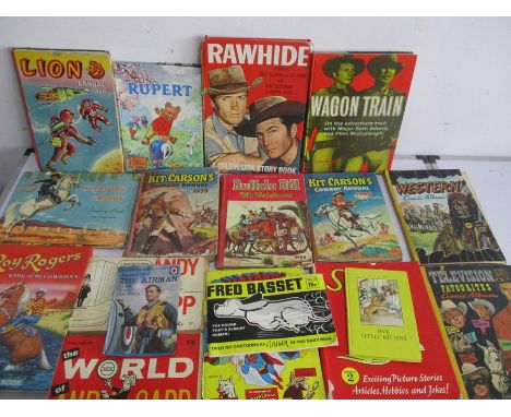 A quantity of vintage annuals and books including wild west annuals, Superman, Rupert Bear etc.