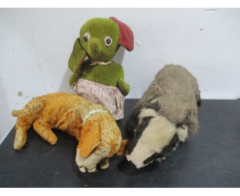A vintage velvet doorstop in the form of a mouse in an apron, pyjama case and a badger