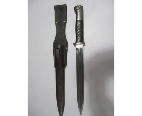 A 41asw bayonet in metal scabbard with leather belt fixings, blade marked 7185, scabbard marked 9755