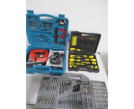 A collection of tools comprising of a Black &amp; Decker jigsaw, drill bits and screwdriver set.